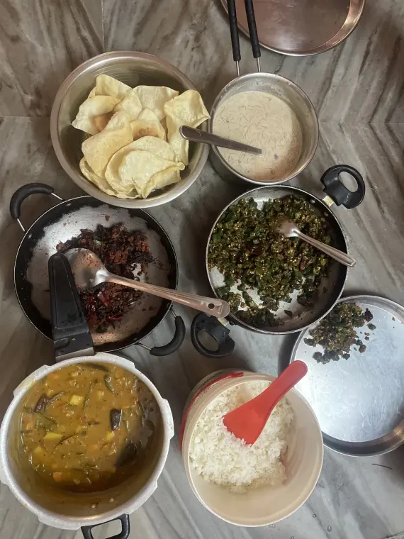 Veg meals from above: sambar, rice, papads, payasam and vegetable sides