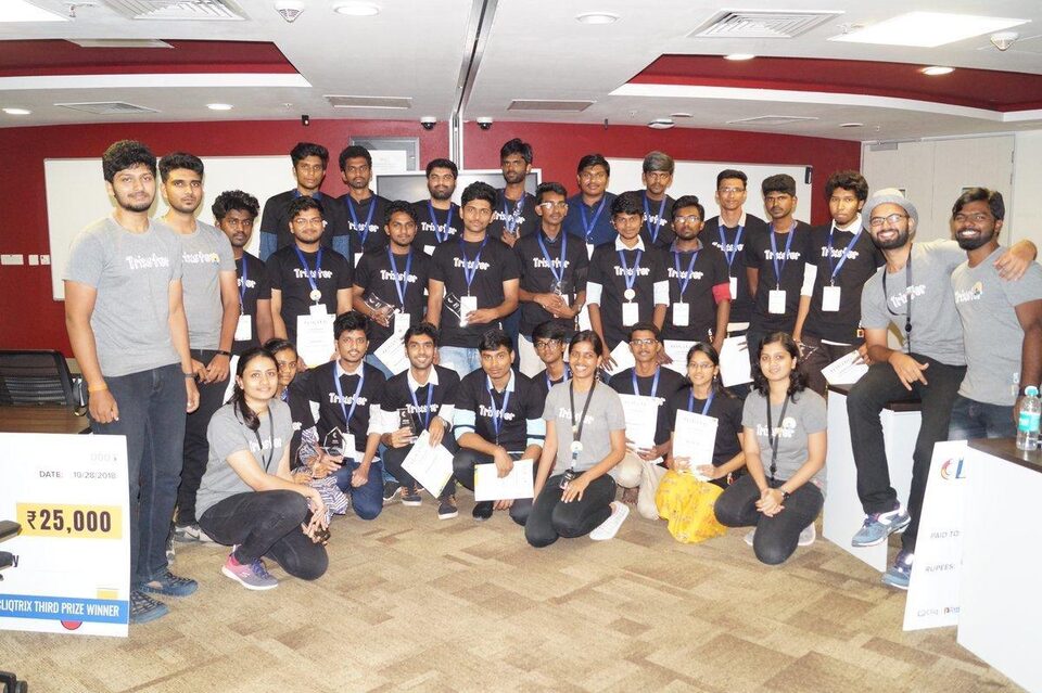 Cliqtrix finalists in Trixster t-shirts posing with certificates and a prize cheque